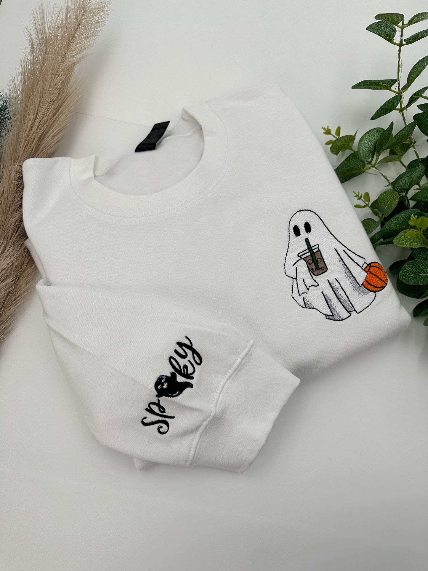 Embroidered Halloween Ghost jumper with spooky on the left sleeve