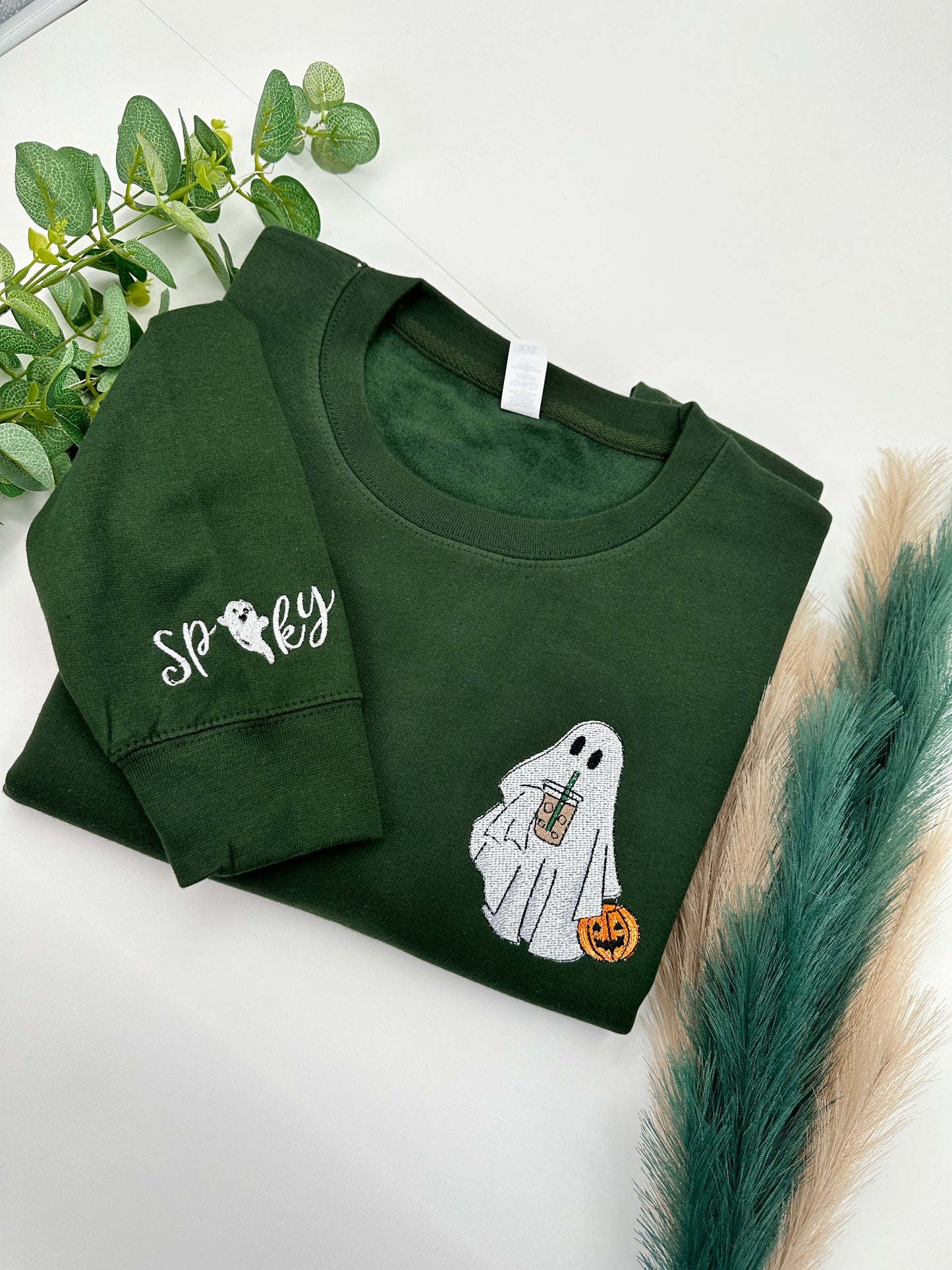 Embroidered Halloween Ghost jumper with spooky on the left sleeve
