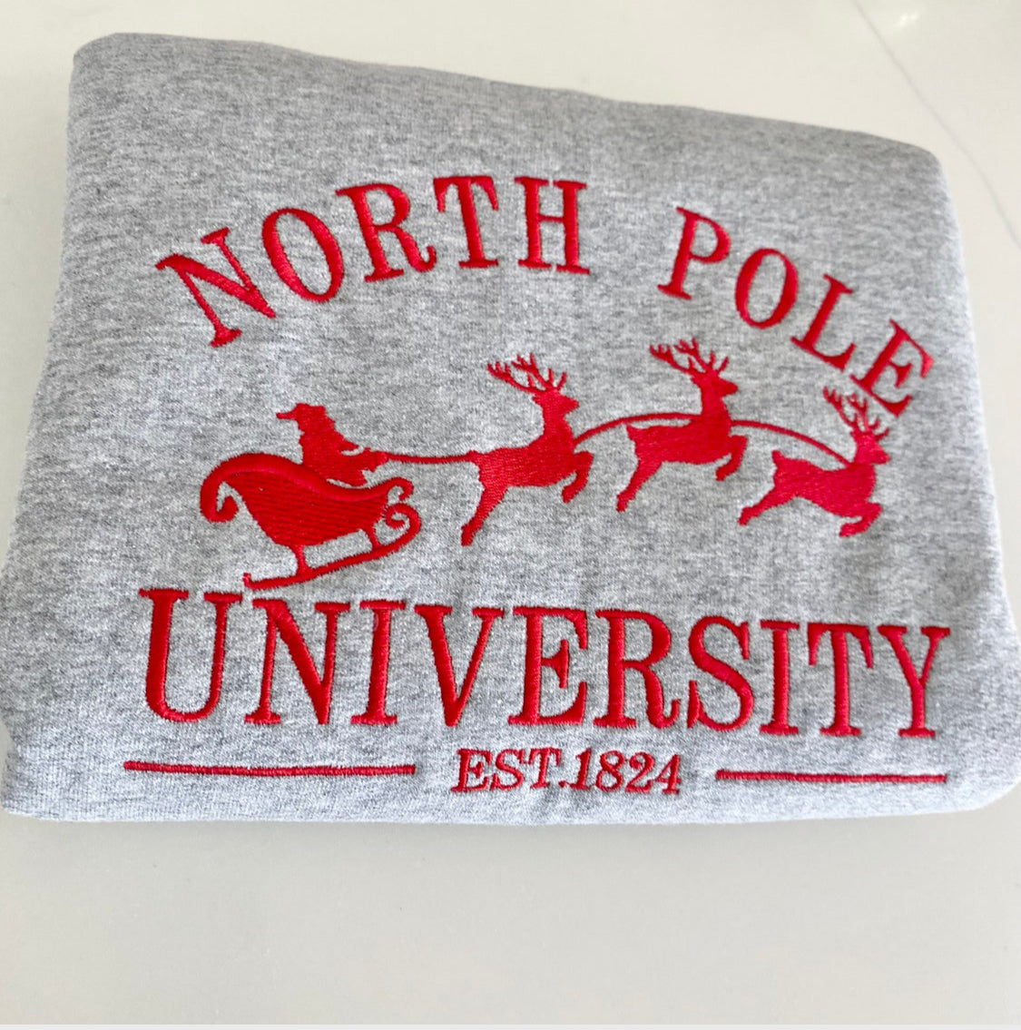 North Pole University Christmas Embroidered Sweatshirt