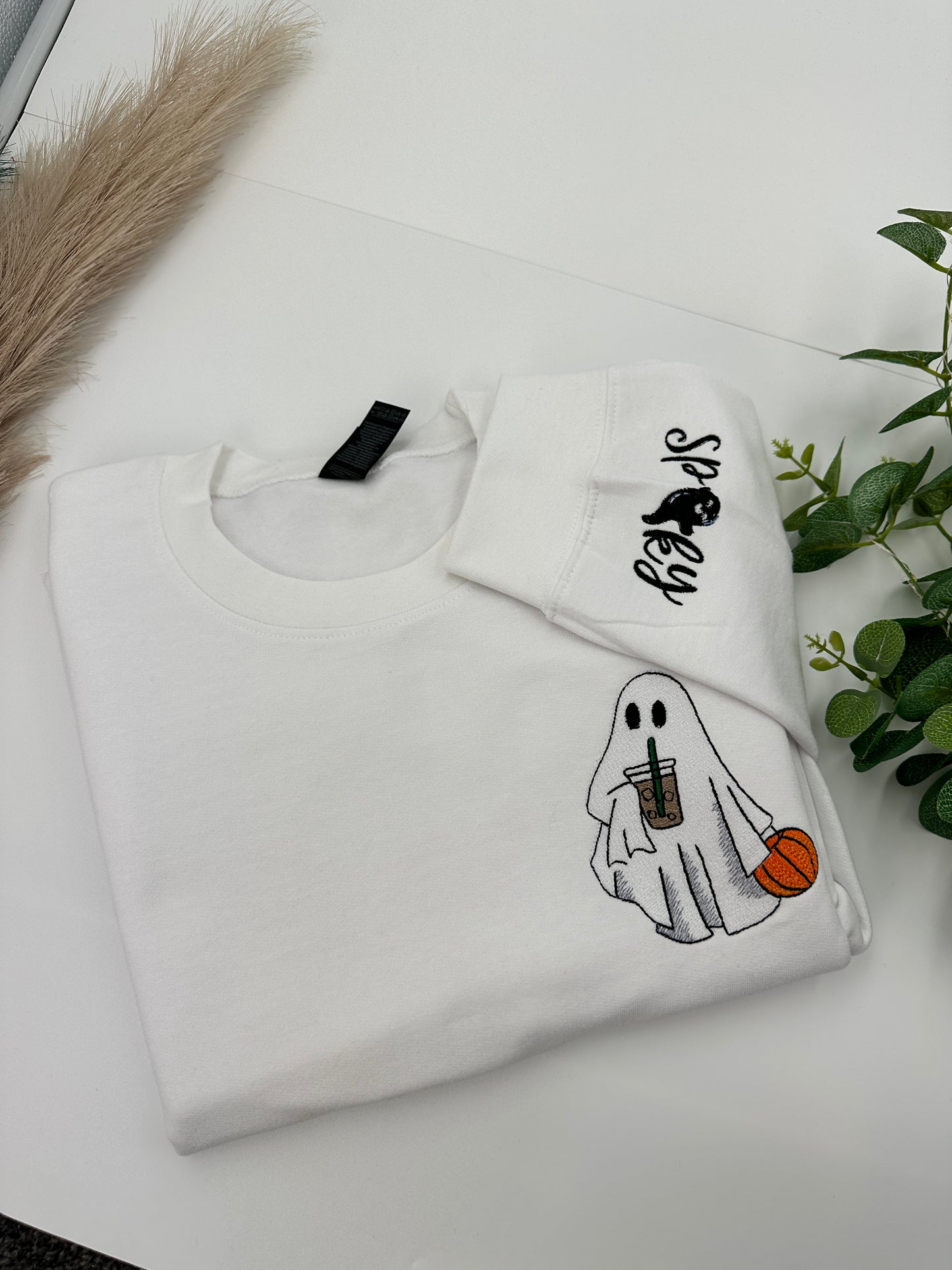 Embroidered Halloween Ghost jumper with spooky on the left sleeve